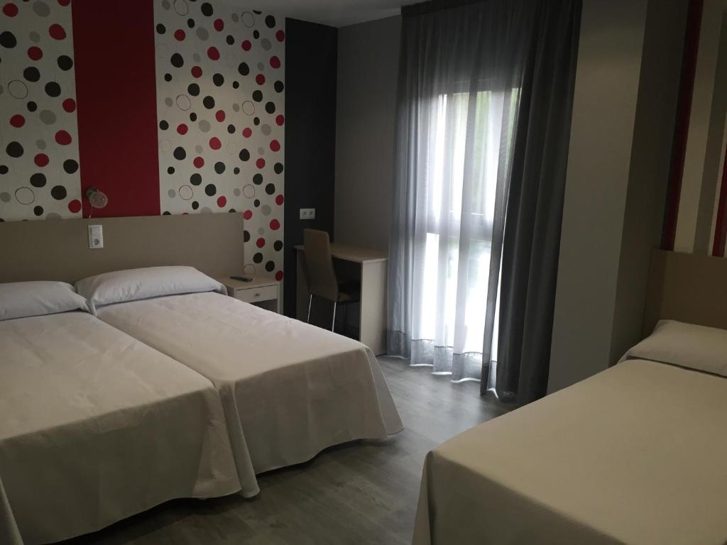 Postel nebo postele na pokoji v ubytování Hotel Siskets