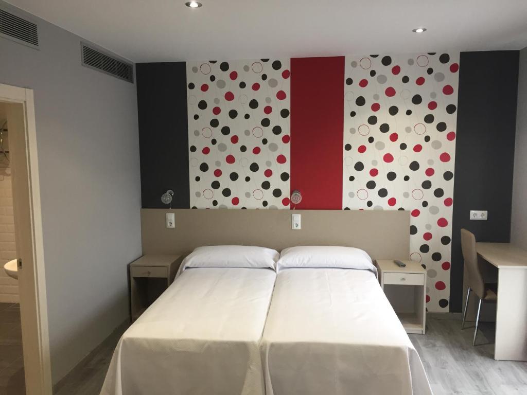 Postel nebo postele na pokoji v ubytování Hotel Siskets