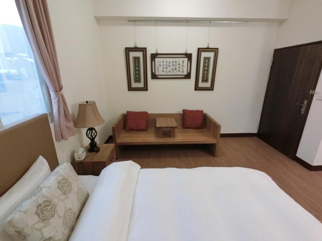 Postel nebo postele na pokoji v ubytování Long Zhi Yue Hotel