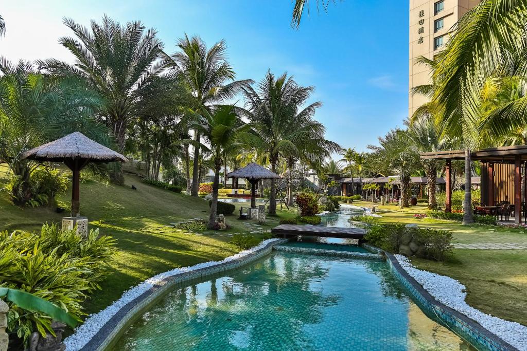 The swimming pool at or close to Queena Plaza Hotel