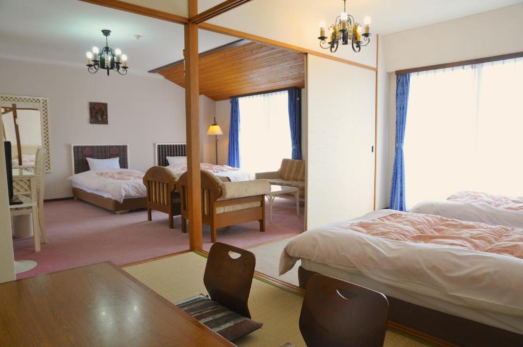 Postel nebo postele na pokoji v ubytování Tateyama Resort Hotel