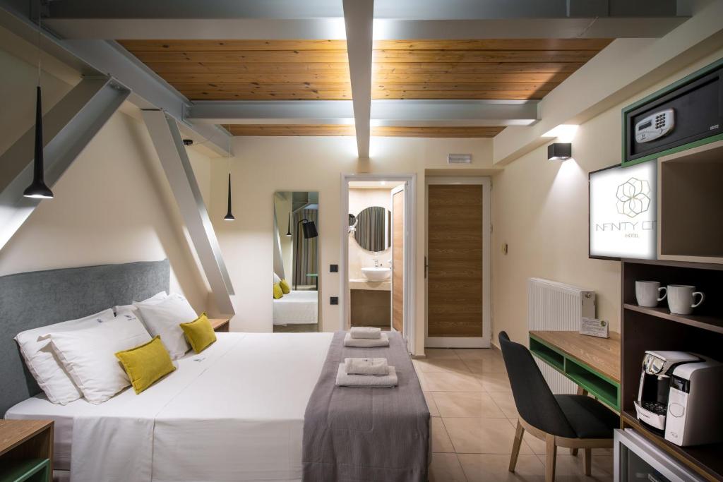 Posteľ alebo postele v izbe v ubytovaní Infinity City Boutique Hotel