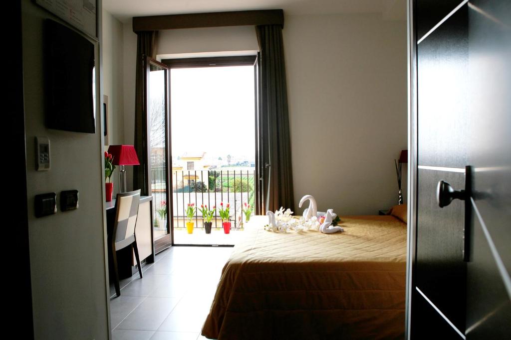 Postel nebo postele na pokoji v ubytování Hotel Visagi