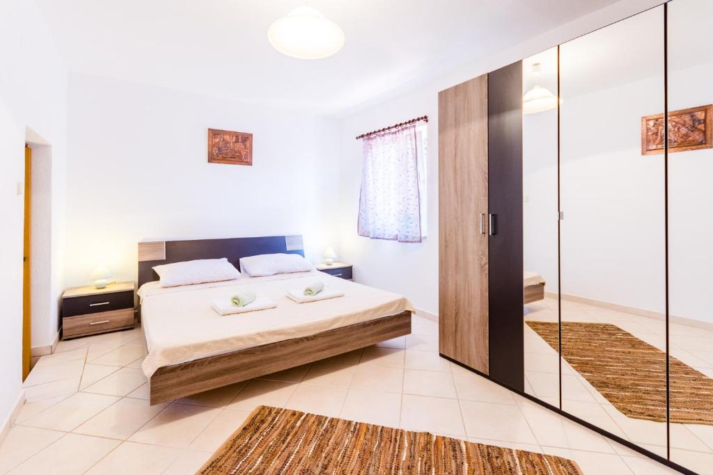 Cama ou camas em um quarto em Villa Klara - AP 4