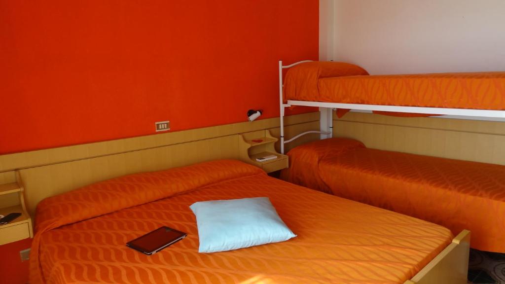A bed or beds in a room at Residence Holiday