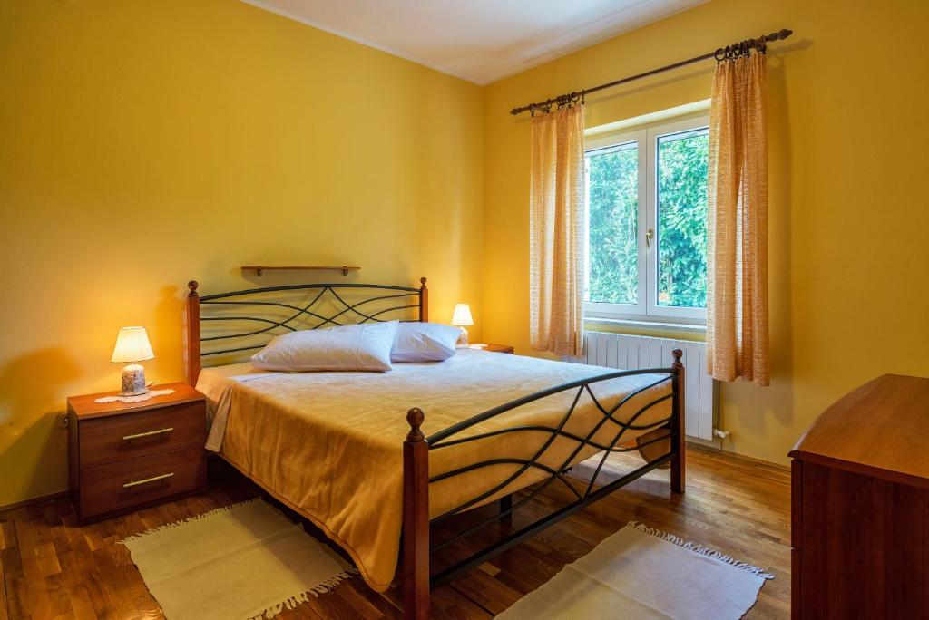 Postel nebo postele na pokoji v ubytování Apartment Majoran