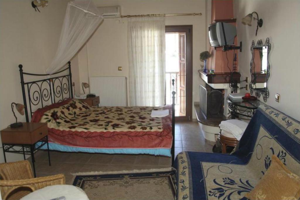 Postel nebo postele na pokoji v ubytování Guesthouse Xenioti
