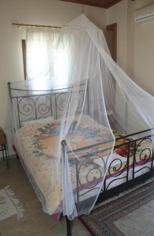 Postel nebo postele na pokoji v ubytování Guesthouse Xenioti