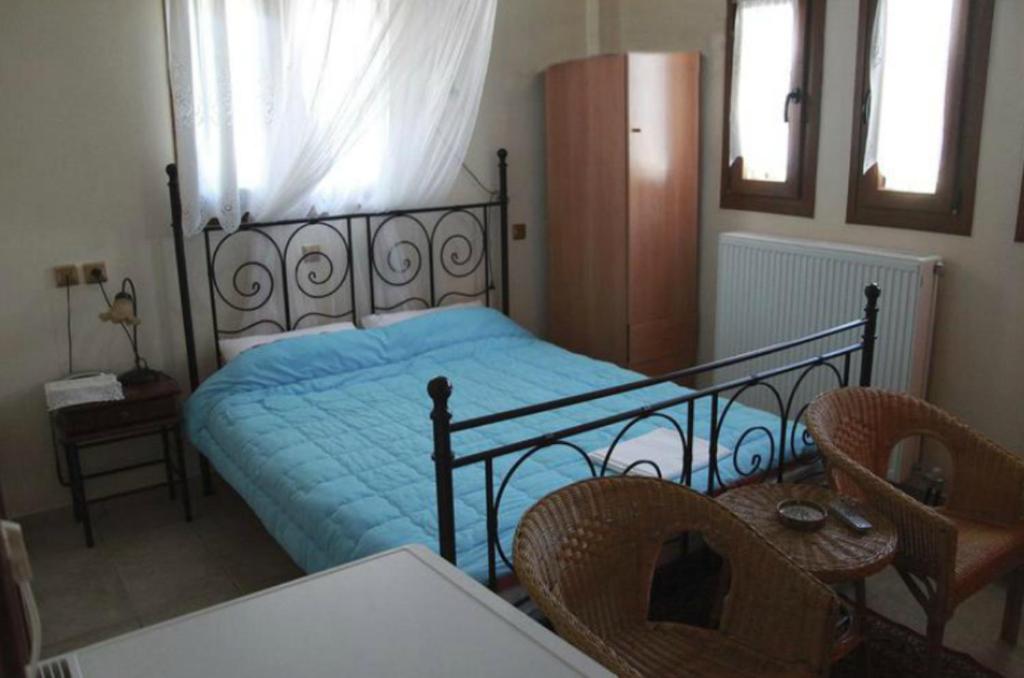 Postel nebo postele na pokoji v ubytování Guesthouse Xenioti