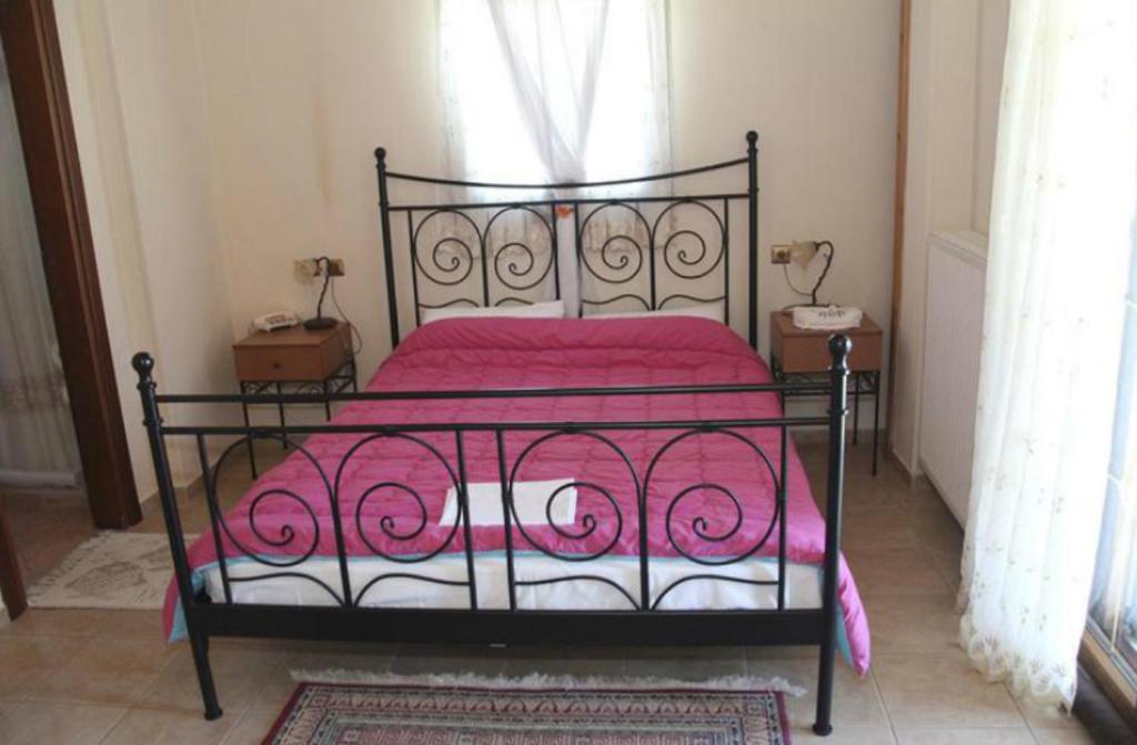 Postel nebo postele na pokoji v ubytování Guesthouse Xenioti