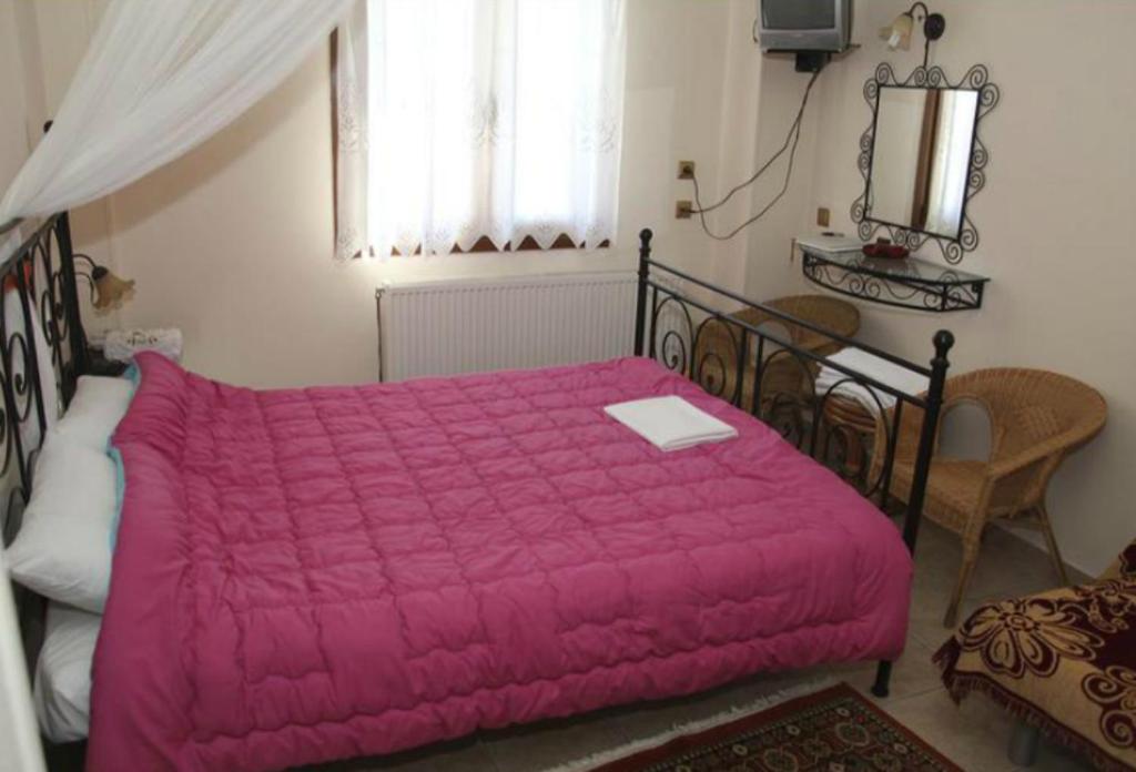 Postel nebo postele na pokoji v ubytování Guesthouse Xenioti