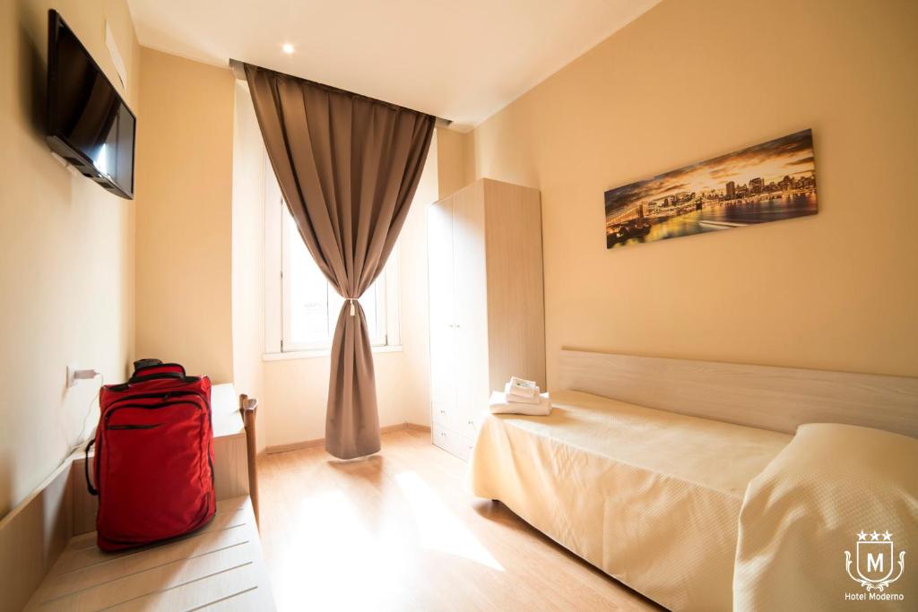 Postel nebo postele na pokoji v ubytování Hotel Moderno