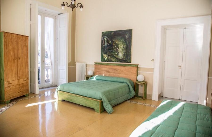Łóżko lub łóżka w pokoju w obiekcie Bnb Villa Lendi