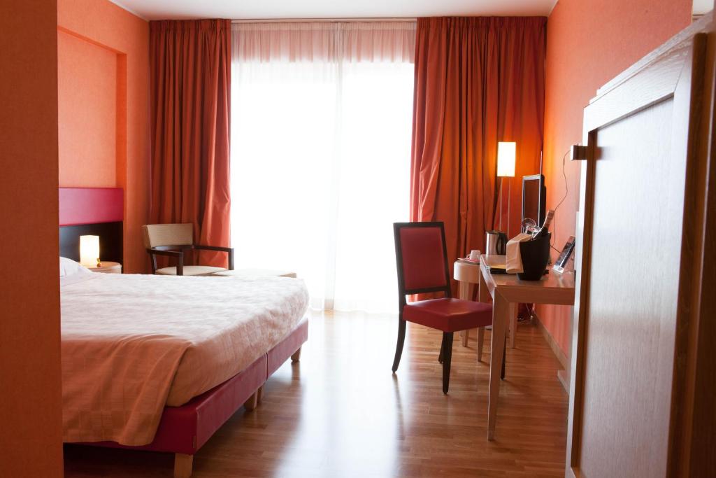 Postel nebo postele na pokoji v ubytování Klass Hotel