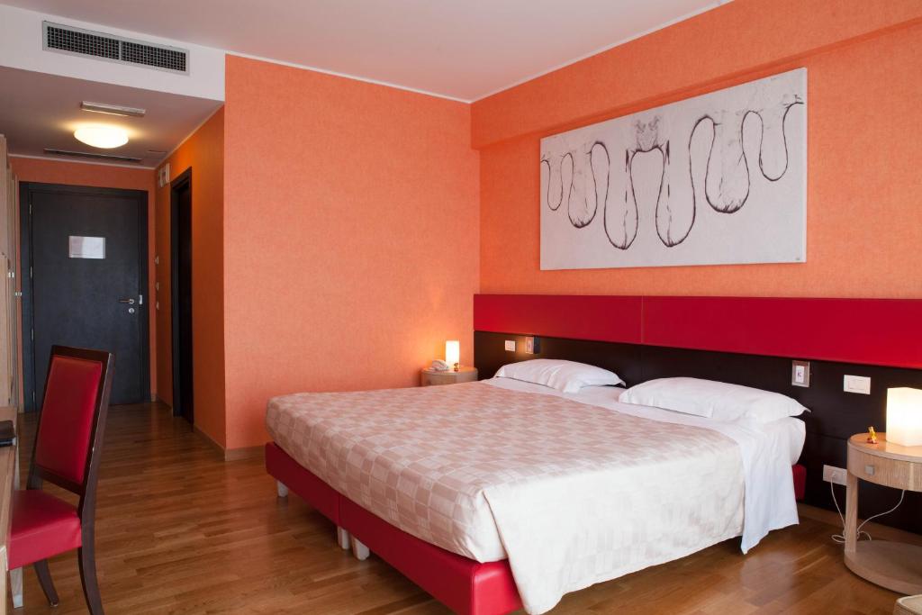 Postel nebo postele na pokoji v ubytování Klass Hotel