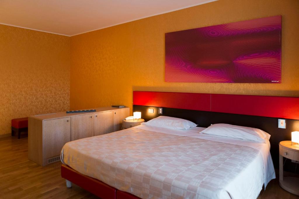 Postel nebo postele na pokoji v ubytování Klass Hotel