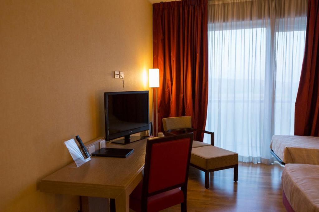 TV a/nebo společenská místnost v ubytování Klass Hotel
