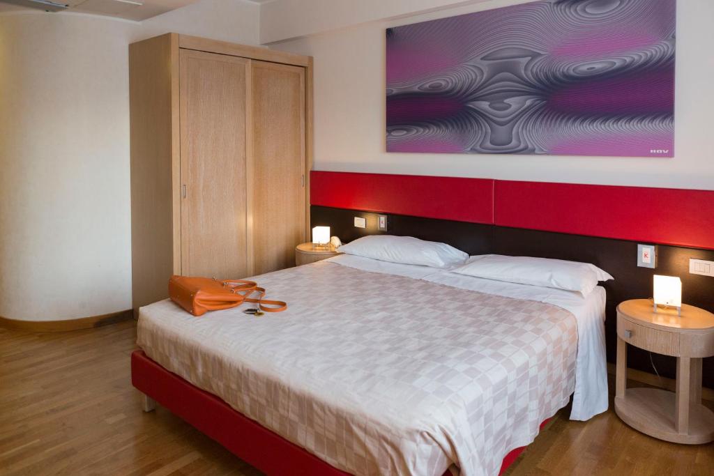 Postel nebo postele na pokoji v ubytování Klass Hotel