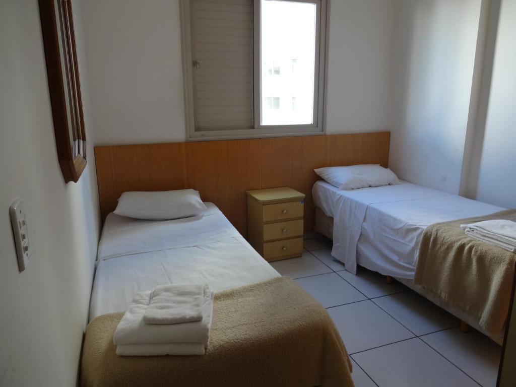 Postel nebo postele na pokoji v ubytování Residencial Genéve