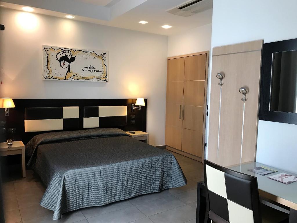 Postel nebo postele na pokoji v ubytování Hotel Visagi