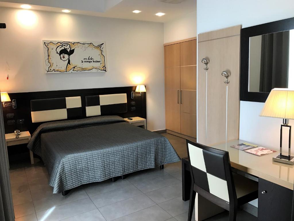 Postel nebo postele na pokoji v ubytování Hotel Visagi