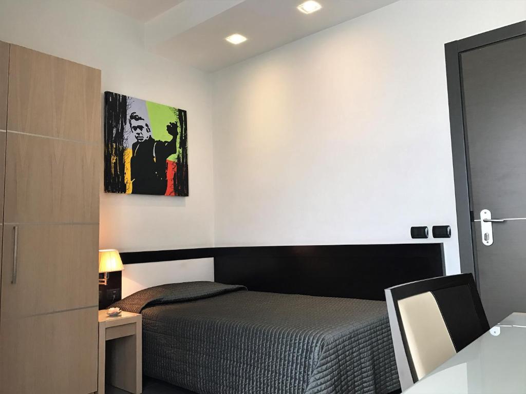 Postel nebo postele na pokoji v ubytování Hotel Visagi