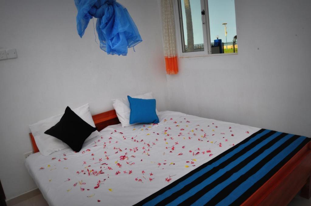 Postel nebo postele na pokoji v ubytování TMS Beach House