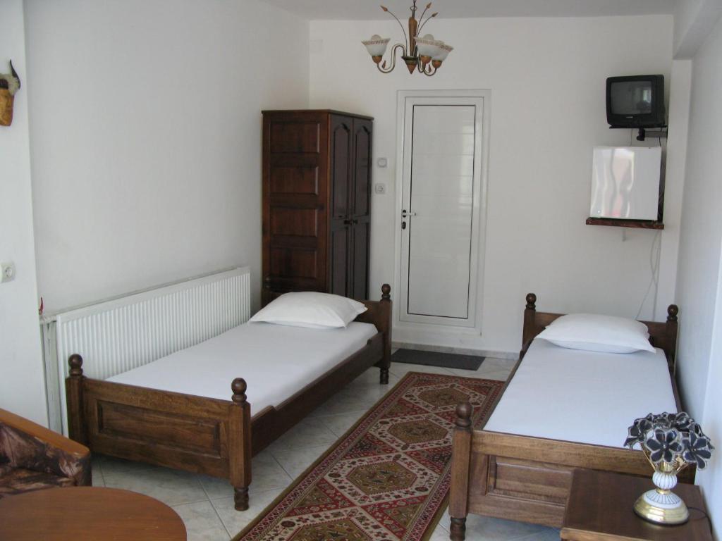 En eller flere senge i et værelse på Guest House Diamant