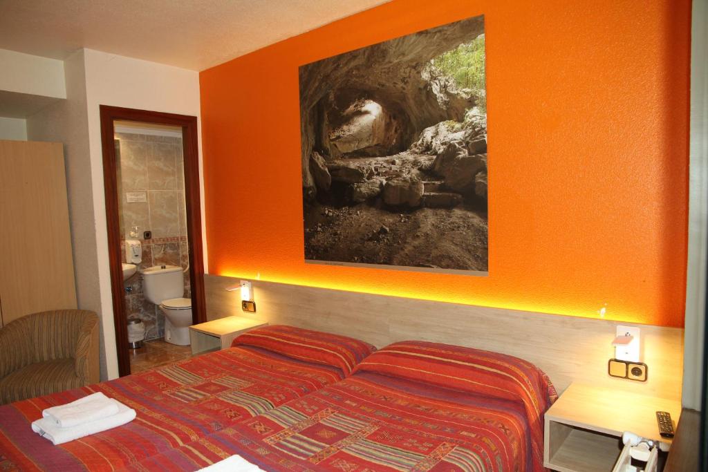 Postel nebo postele na pokoji v ubytování Hostal Acella