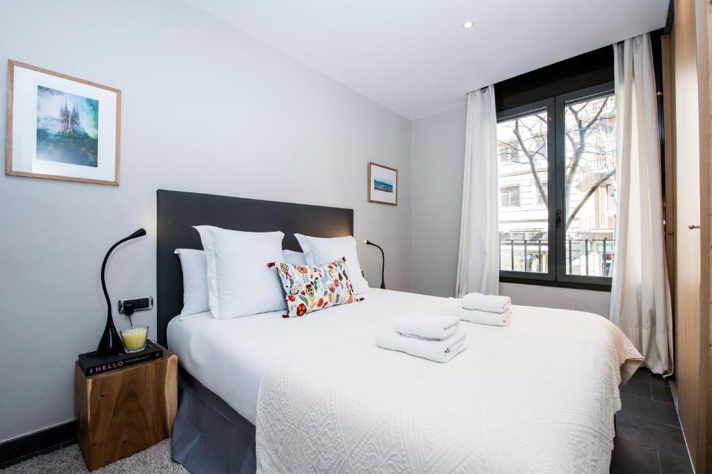 Postel nebo postele na pokoji v ubytování C211 Barcelona Apartments