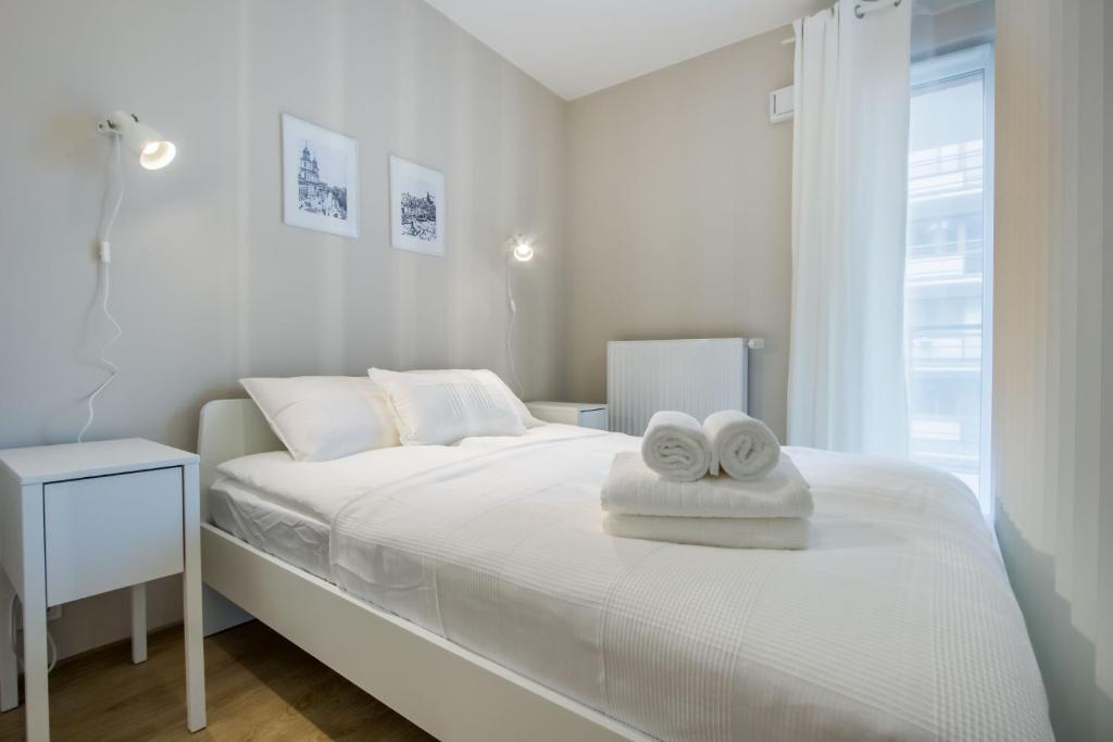 Posteľ alebo postele v izbe v ubytovaní Okrzei 18 - studio by Homeprime