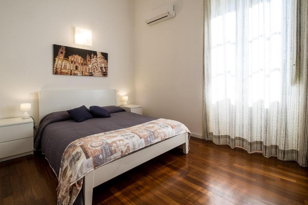 Postel nebo postele na pokoji v ubytování Ai Lattarini House