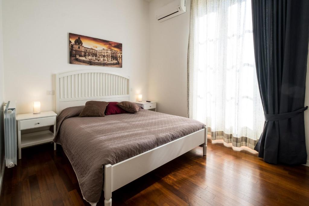 Postel nebo postele na pokoji v ubytování Ai Lattarini House
