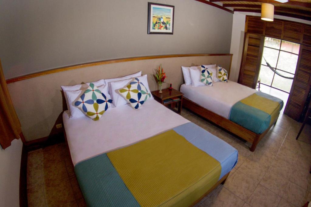 Postel nebo postele na pokoji v ubytování Heliconia Amazon River Lodge