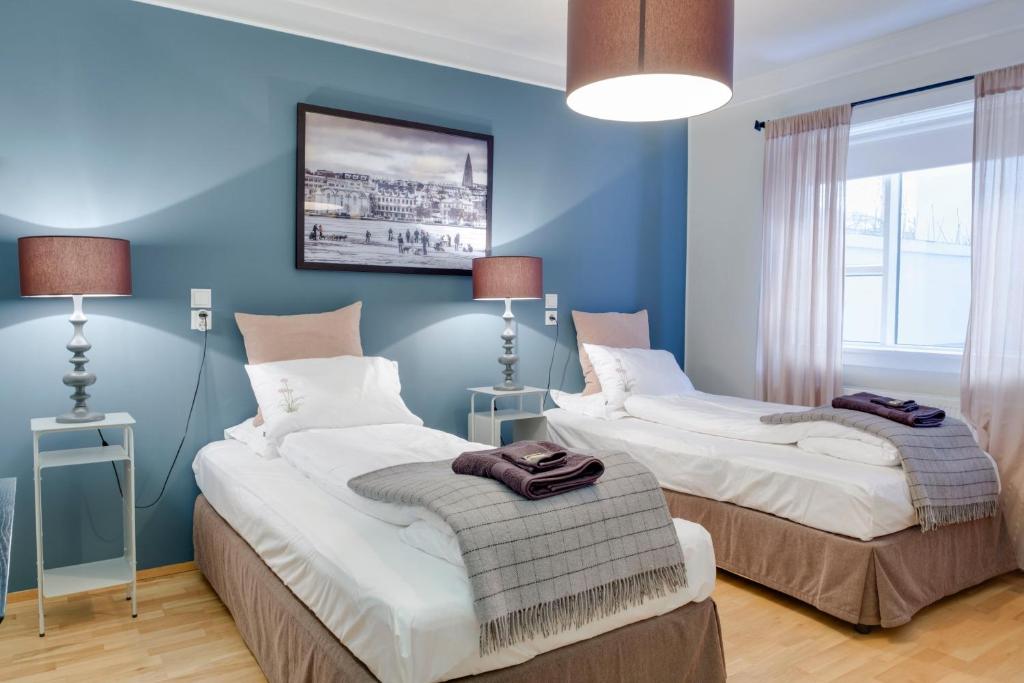 Postel nebo postele na pokoji v ubytování Freyja Guesthouse & Suites