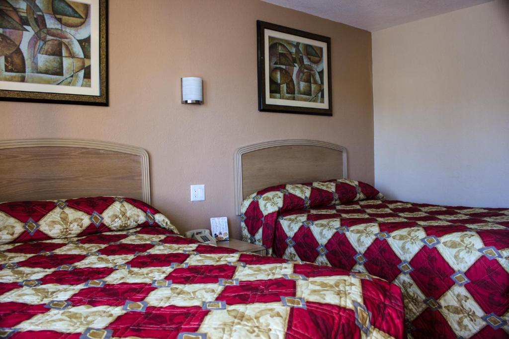 Cama o camas de una habitación en Budget Inn of Daytona Beach