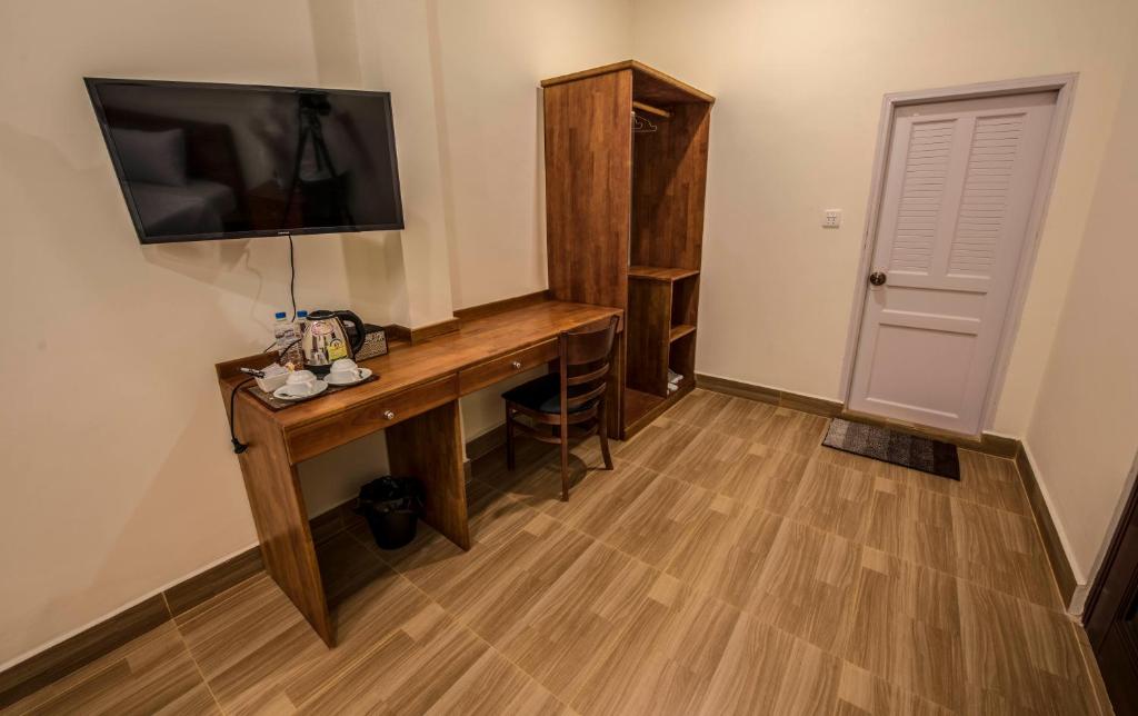 TV a/nebo společenská místnost v ubytování Phnom Penh Le Vincent Hotel