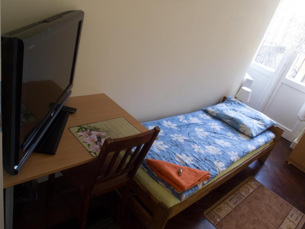 Televízia a/alebo spoločenská miestnosť v ubytovaní Villa Oliva