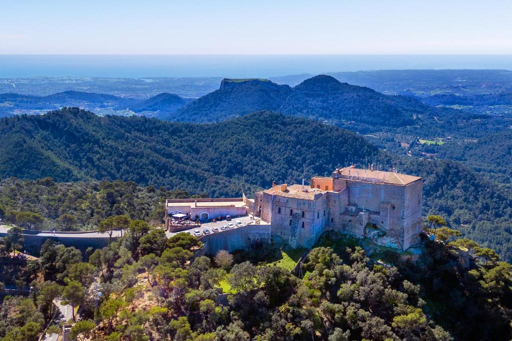 an aerial view of a building on a mountain at Petit Hotel Hostatgeria Sant Salvador in Felanitx