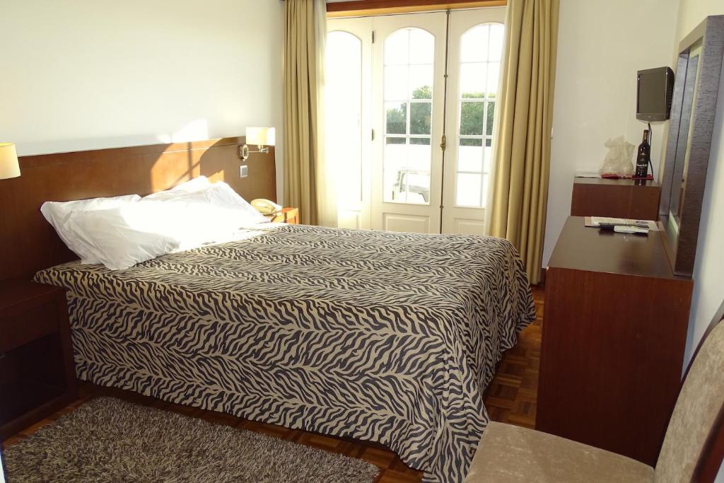 Postel nebo postele na pokoji v ubytování Hotel Mira Rio