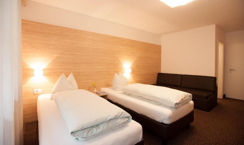 Postel nebo postele na pokoji v ubytování Hotel Stifter