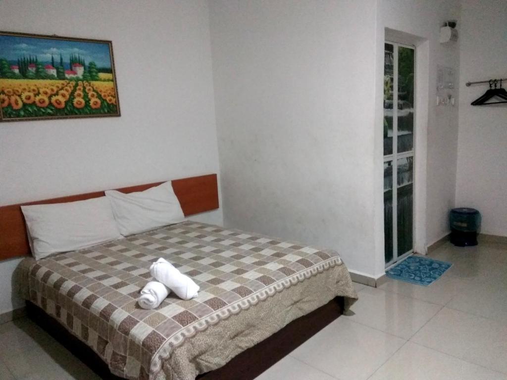 Katil atau katil-katil dalam bilik di Aloha Hotel