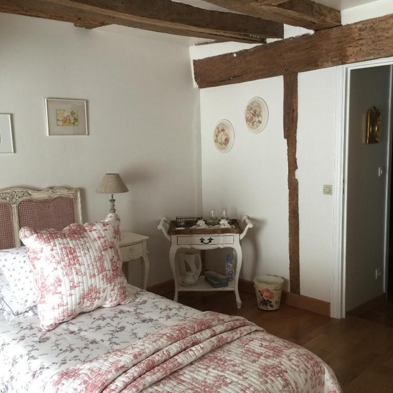 Postel nebo postele na pokoji v ubytování B&B les Agapanthes