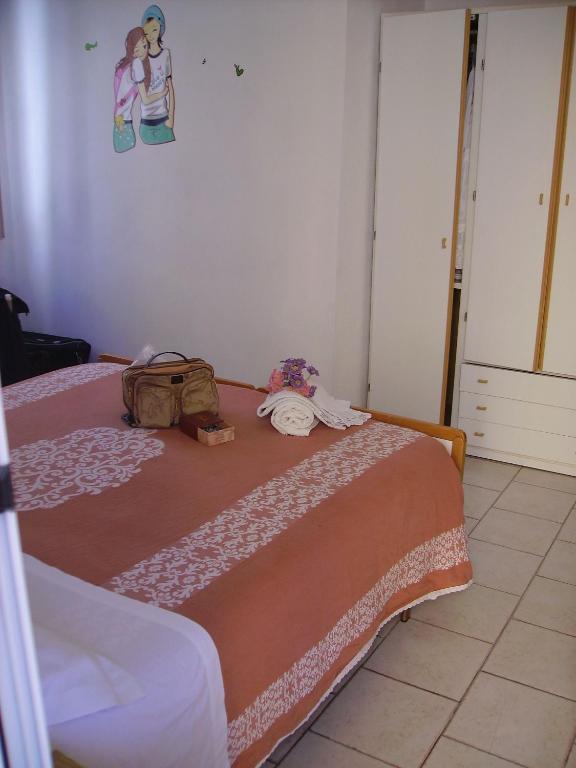Postel nebo postele na pokoji v ubytování Albergo Maria Gabriella