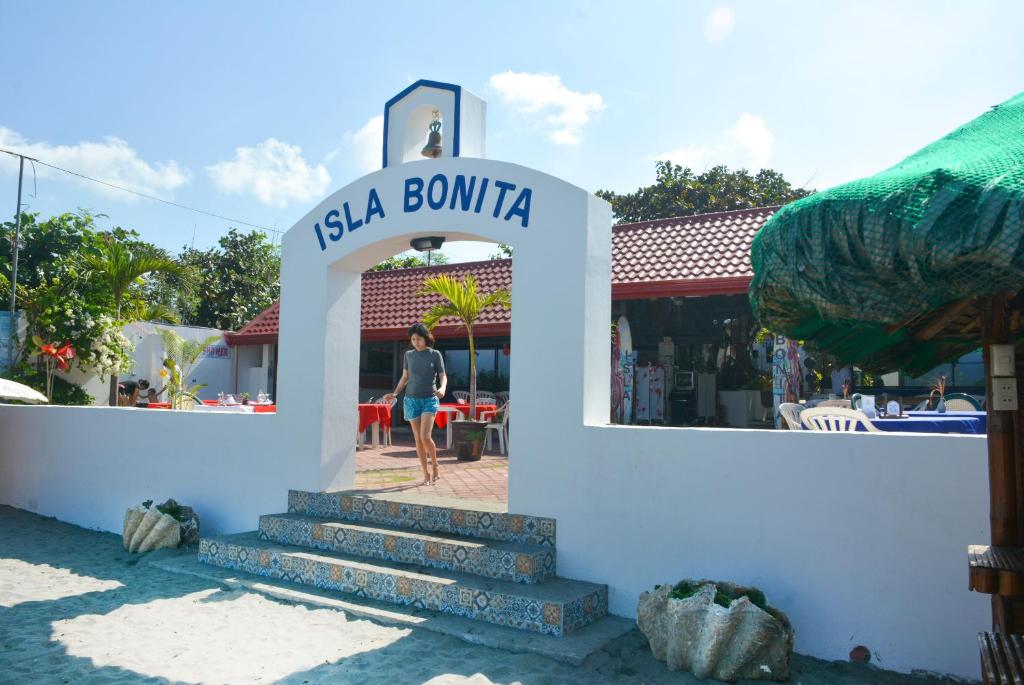 a sign for aeria bonita with a woman standing in front at Isla Bonita Beach Resort in San Juan