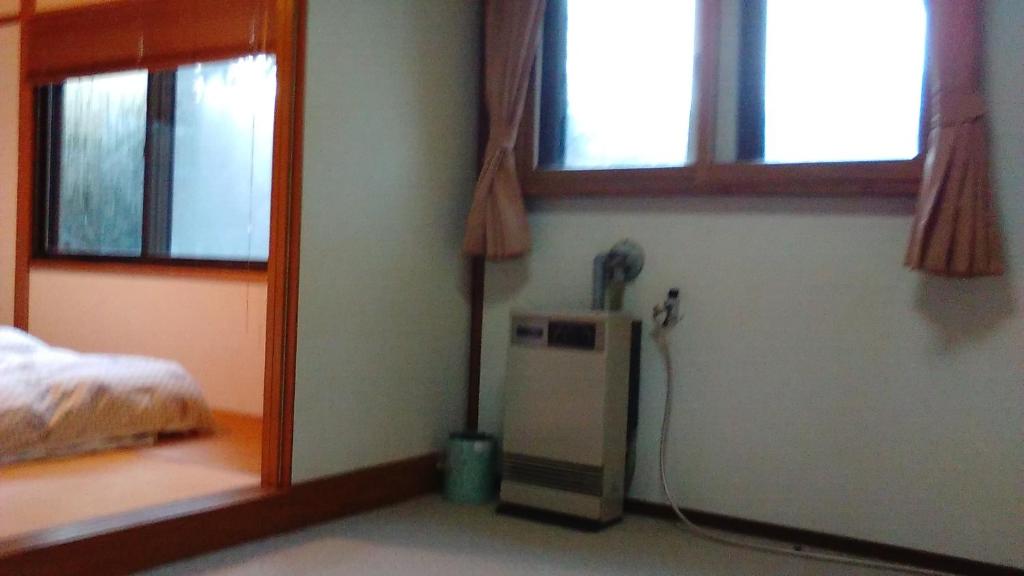 Postel nebo postele na pokoji v ubytování Raumu San-so