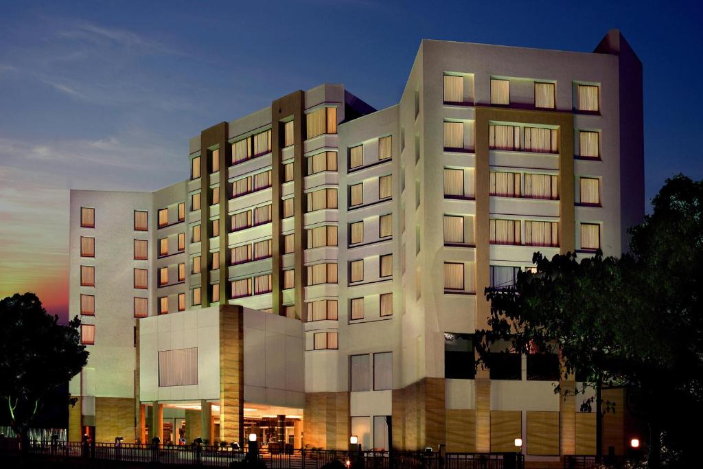 a large building with lights on in front of it at Fortune Select Trinity, Bengaluru - Member ITC's Hotel Group in Bangalore