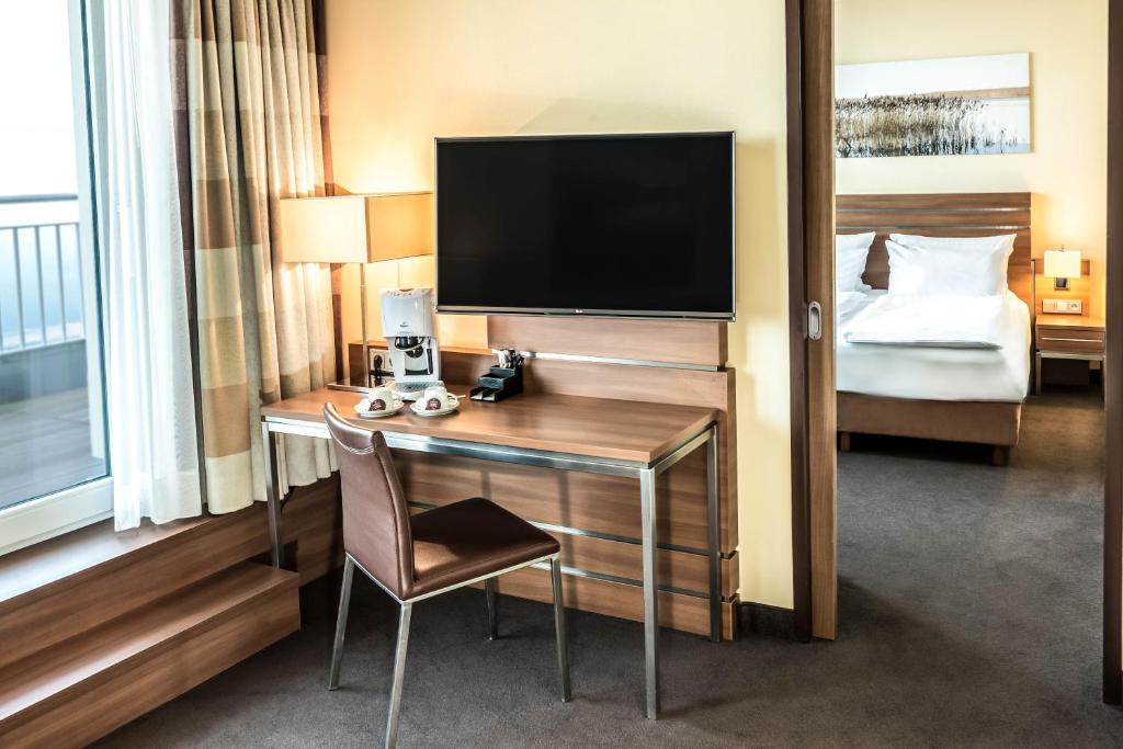 Ein Bett oder Betten in einem Zimmer der Unterkunft Seehotel Fleesensee