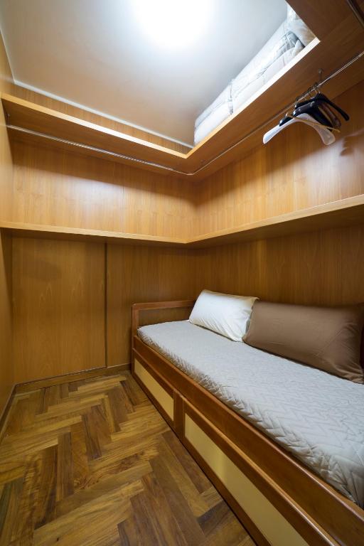 a small room with two beds in a boat at B&B 'O Sole Mio! in Naples