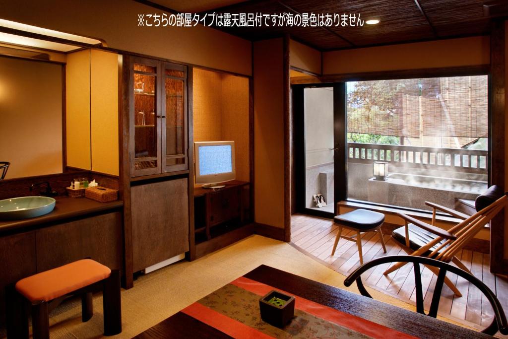 Ein Balkon oder eine Terrasse in der Unterkunft Umibenokakureyu Seiryu